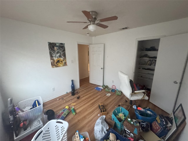 bedroom featuring wood-type flooring and ceiling fan