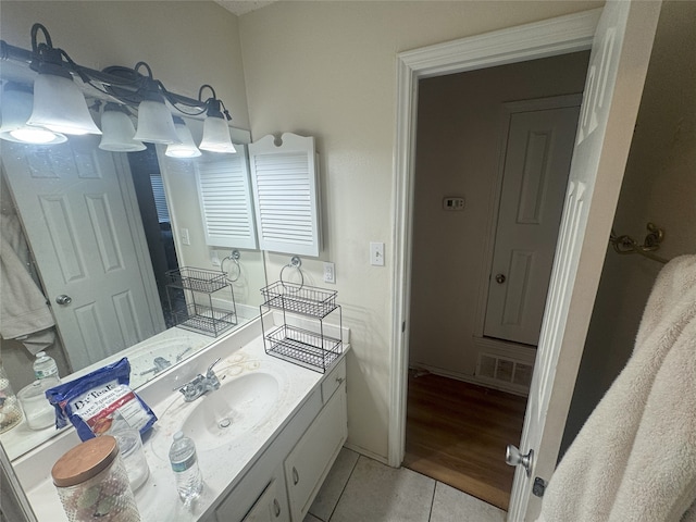 bathroom with tile patterned flooring and vanity