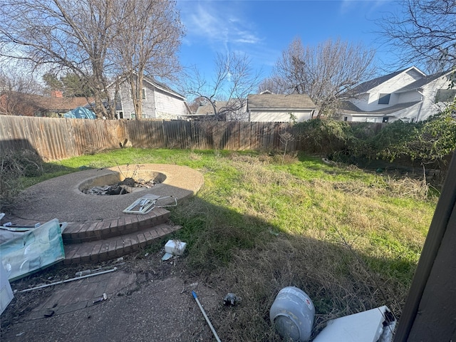 view of yard with an outdoor fire pit