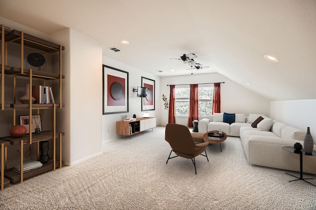 carpeted living room featuring lofted ceiling