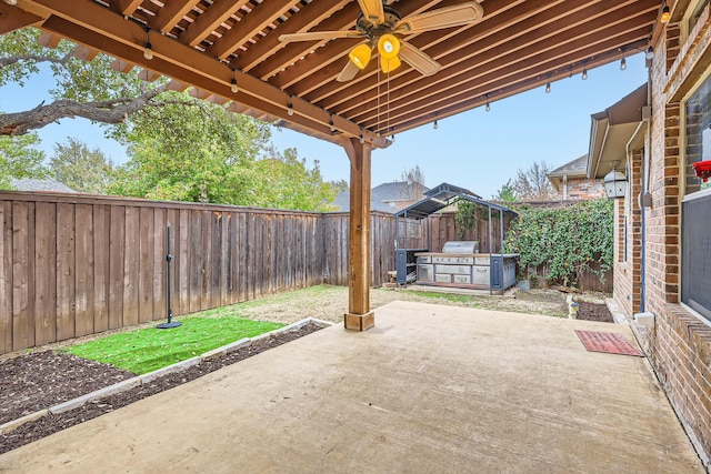 view of patio featuring ceiling fan