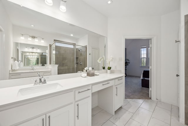 bathroom featuring vanity and an enclosed shower