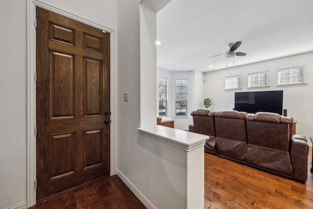 entryway featuring ceiling fan and dark hardwood / wood-style floors