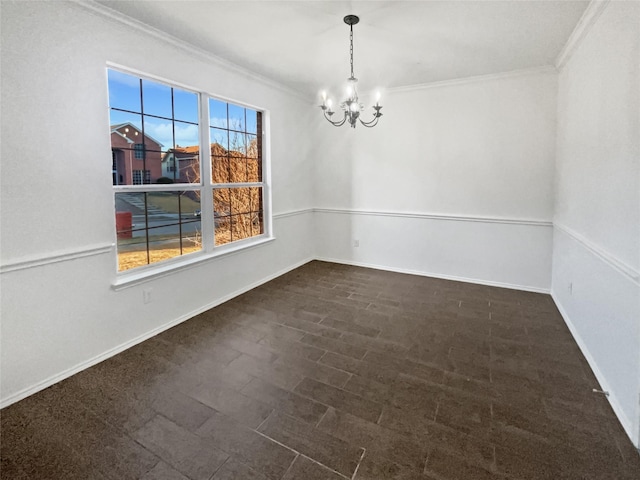 unfurnished room with crown molding and a notable chandelier