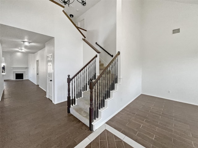 stairs featuring a high ceiling