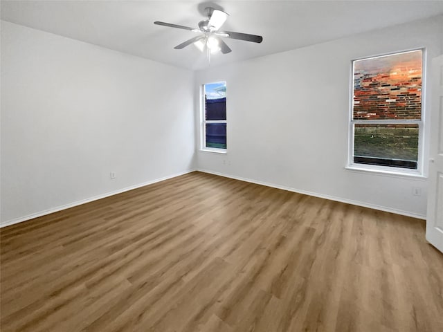 unfurnished room featuring ceiling fan and light wood-type flooring