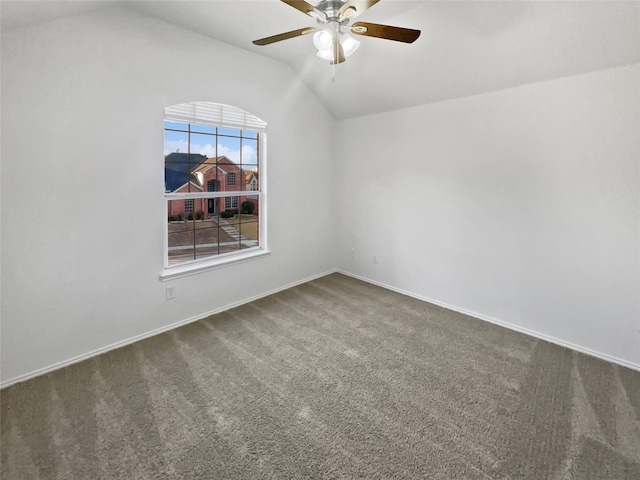 unfurnished room with lofted ceiling, ceiling fan, and carpet