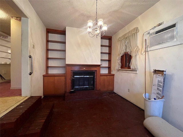 unfurnished living room with a chandelier, a brick fireplace, and a textured ceiling