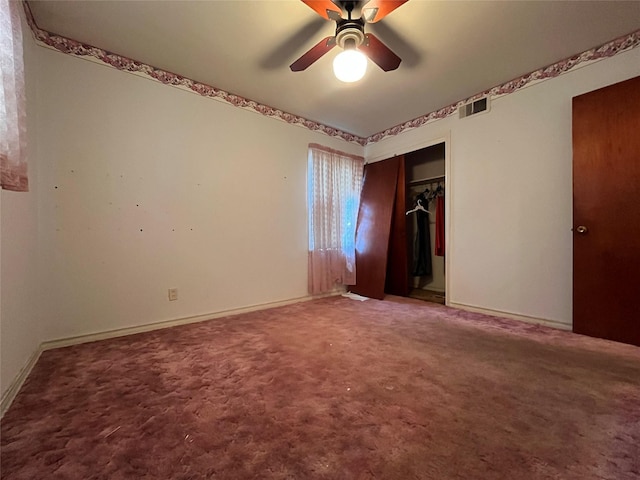 unfurnished bedroom with ceiling fan, carpet floors, and a closet