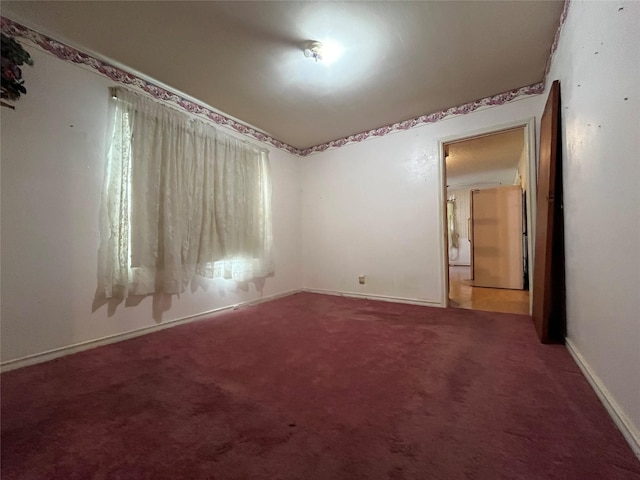 unfurnished room with carpet floors