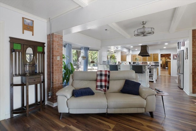 living room with beamed ceiling and dark wood-type flooring