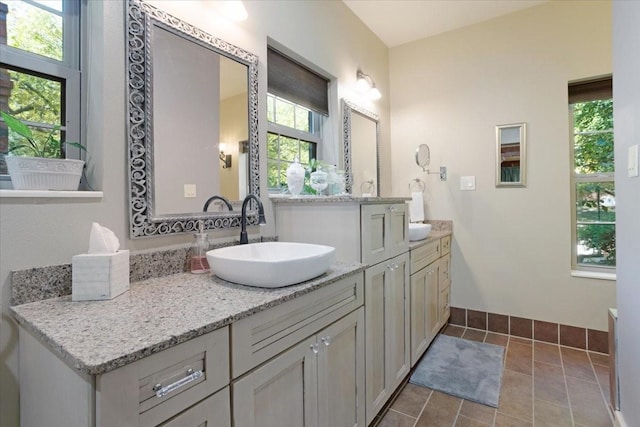 bathroom with tile patterned flooring and vanity