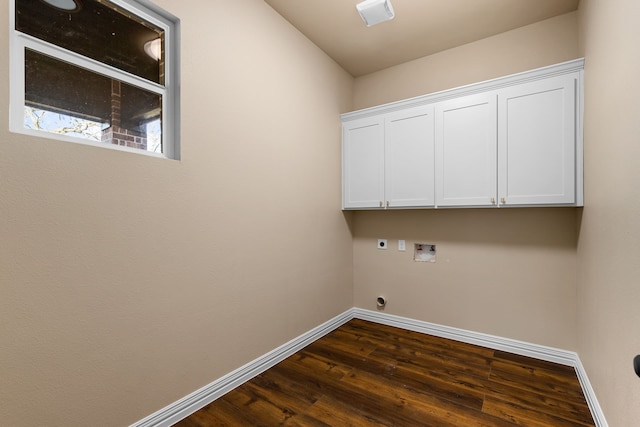 clothes washing area featuring cabinets, washer hookup, dark hardwood / wood-style floors, and electric dryer hookup