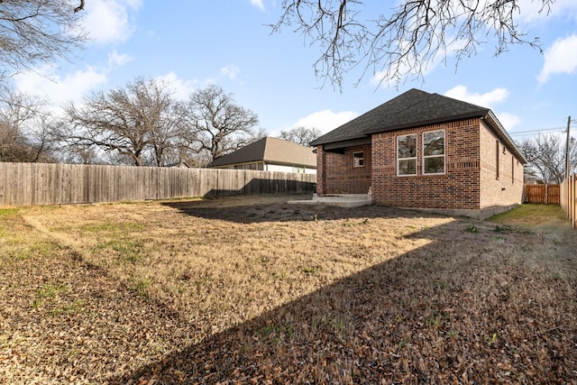 rear view of house with a lawn