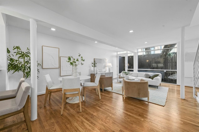 living room featuring hardwood / wood-style flooring and expansive windows