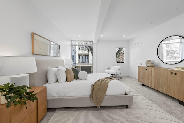 bedroom featuring light carpet