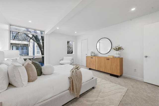 bedroom featuring light colored carpet