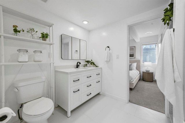 bathroom with vanity and toilet