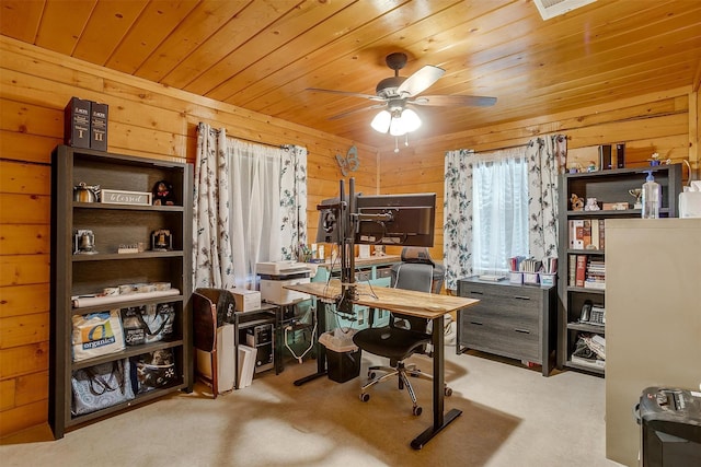 office area featuring ceiling fan, light colored carpet, wooden walls, and wooden ceiling