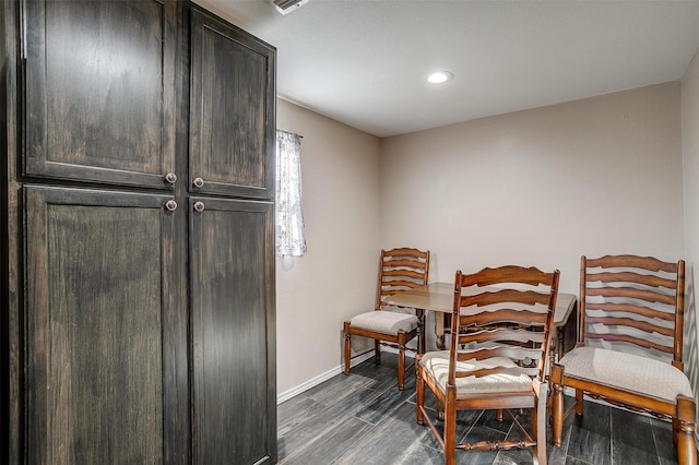 dining space with dark wood-type flooring