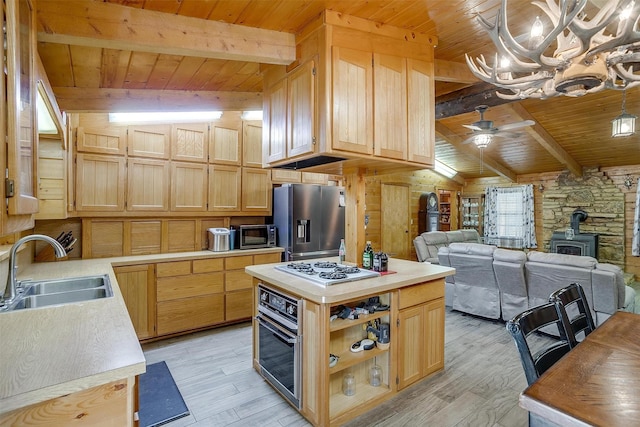 kitchen featuring stainless steel fridge with ice dispenser, sink, oven, and light brown cabinets