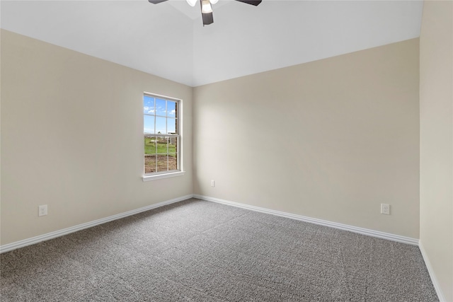 spare room featuring ceiling fan, lofted ceiling, and carpet flooring