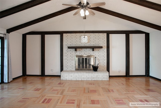 unfurnished living room featuring light parquet floors, a brick fireplace, vaulted ceiling with beams, and ceiling fan