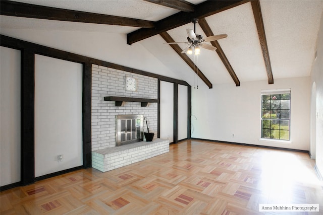 unfurnished living room with light parquet floors, vaulted ceiling with beams, a fireplace, and a textured ceiling