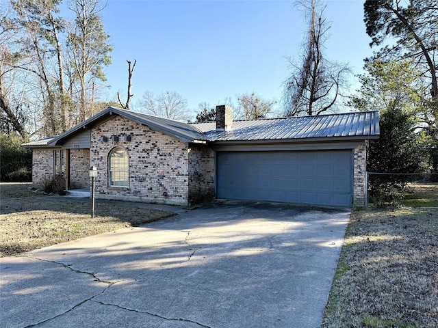 ranch-style house featuring a garage