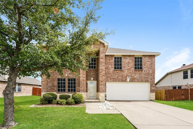 view of front of home with a garage and a front lawn