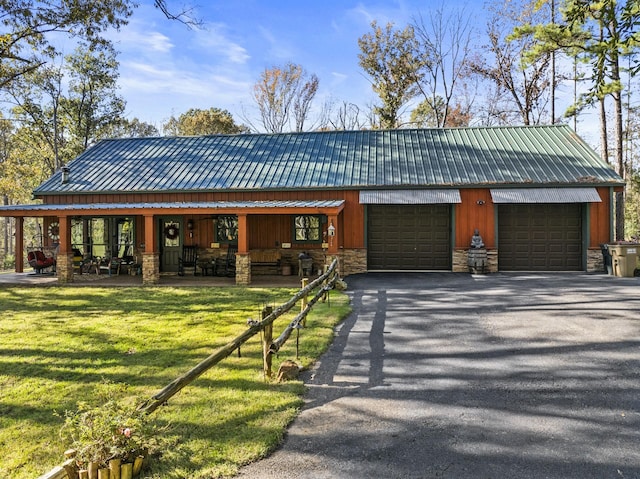 view of front of house with a garage and a front yard