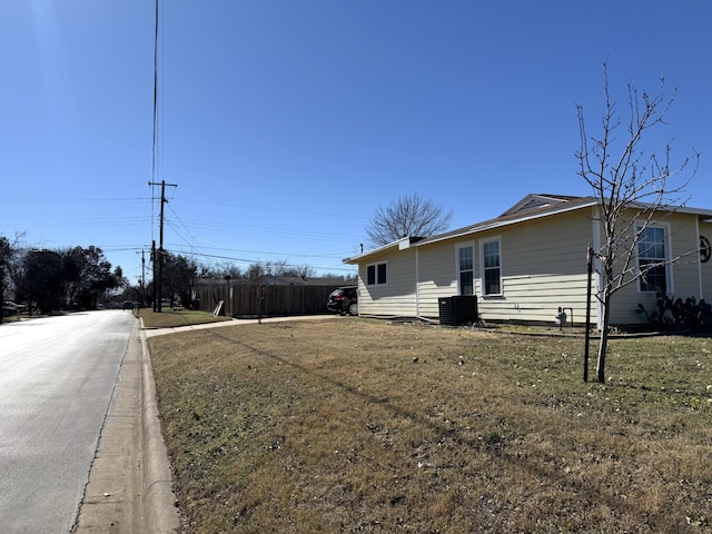 view of property exterior with a yard