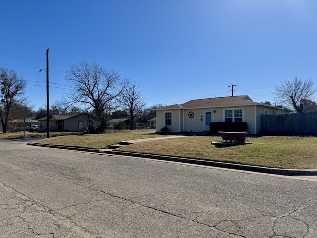 single story home with a front lawn