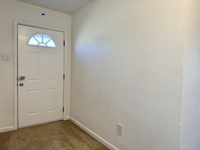 doorway featuring carpet