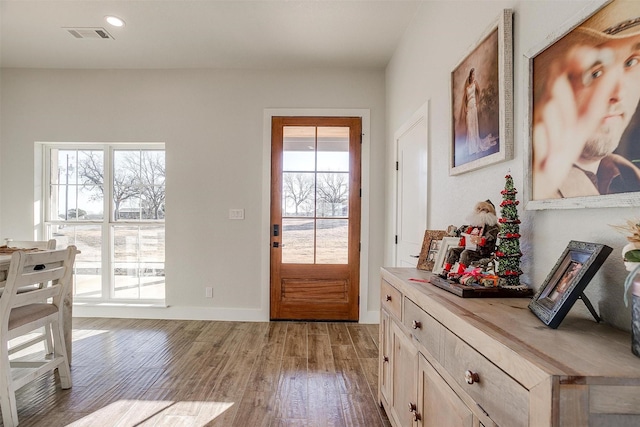 doorway to outside with light hardwood / wood-style flooring