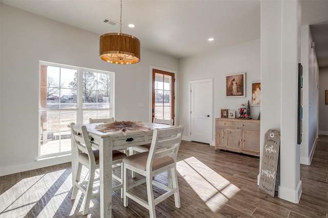 dining area featuring dark hardwood / wood-style floors