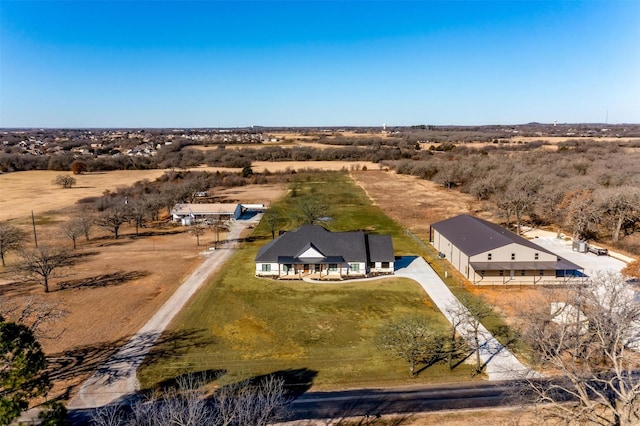 birds eye view of property featuring a rural view