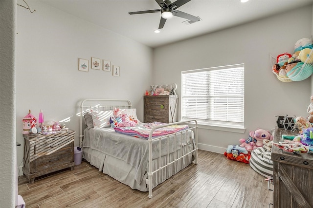 bedroom with hardwood / wood-style flooring and ceiling fan