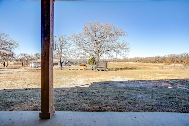 view of yard with a rural view