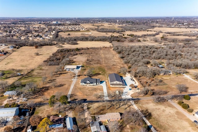 birds eye view of property featuring a desert view and a rural view