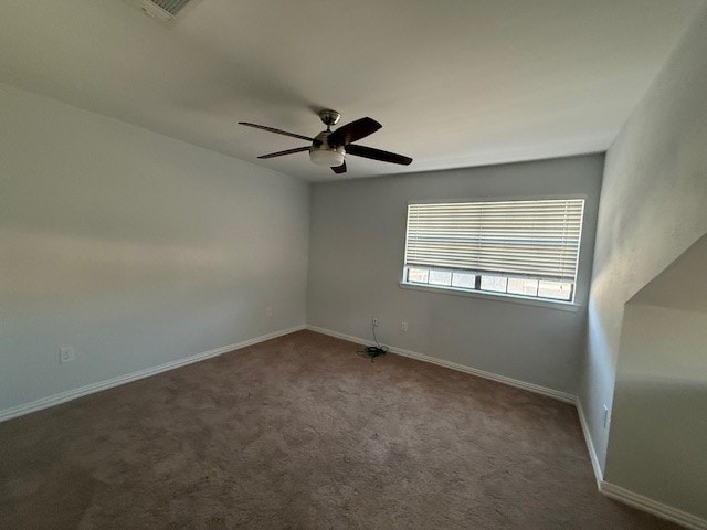 carpeted empty room featuring ceiling fan