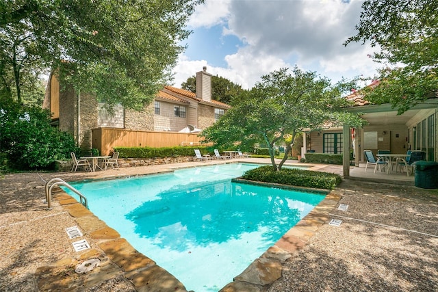 view of swimming pool with a patio