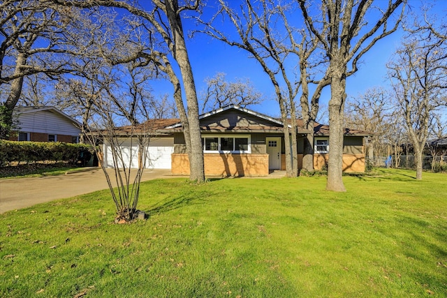 view of front facade with a garage and a front lawn