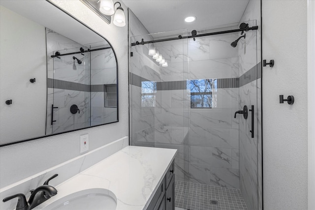 bathroom featuring vanity and an enclosed shower