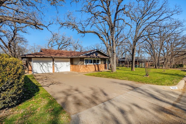 ranch-style home featuring a garage and a front yard