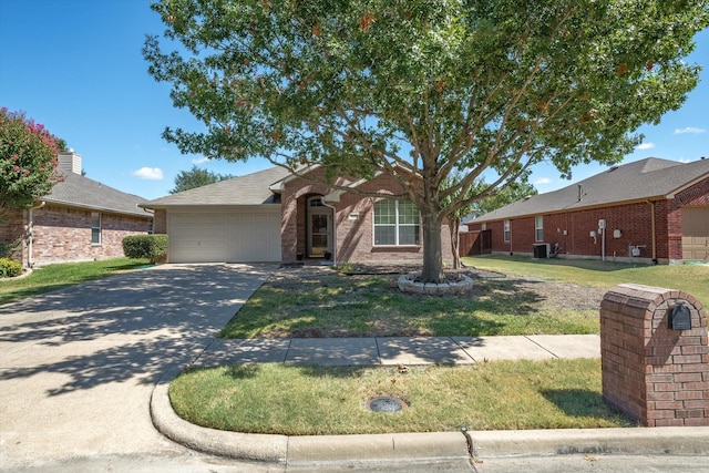 ranch-style home with a garage and a front yard