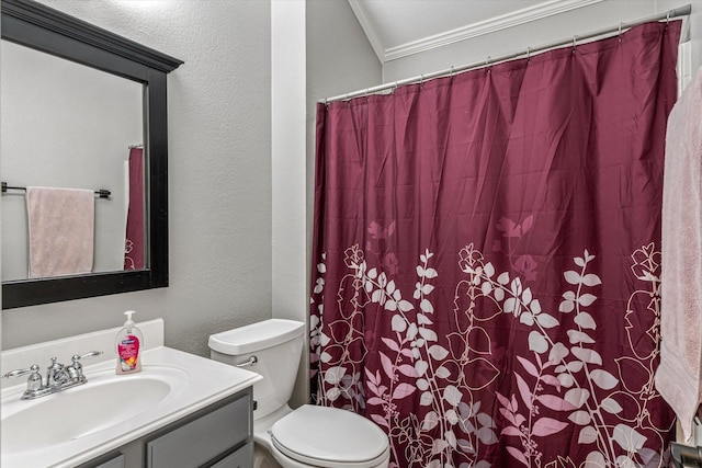 bathroom featuring vanity, crown molding, and toilet