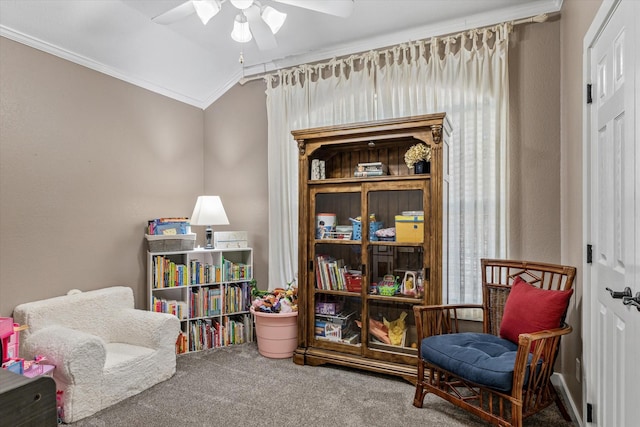 living area featuring lofted ceiling, crown molding, ceiling fan, and carpet flooring