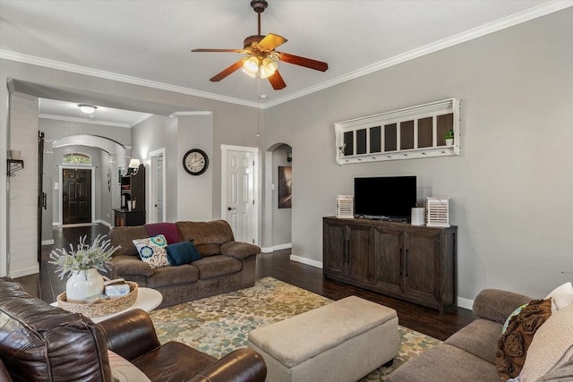 living room with dark hardwood / wood-style flooring, crown molding, and ceiling fan