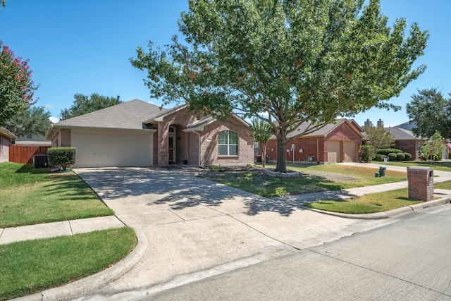 ranch-style house featuring cooling unit, a garage, and a front yard